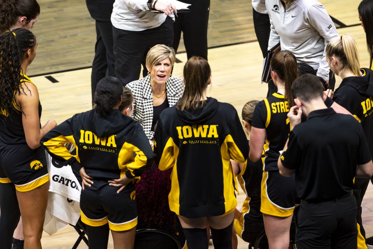 Iowa head coach Jan Jensen talks to the team during a timeout at basketball game between the Iowa Hawkeyes and the UConn Huskies at the Barclays Center in Brooklyn, NY on Saturday, Dec. 20, 2025. The Huskies defeated the Hawkeyes 90-64. (Emma Calabro/The Daily Iowan)