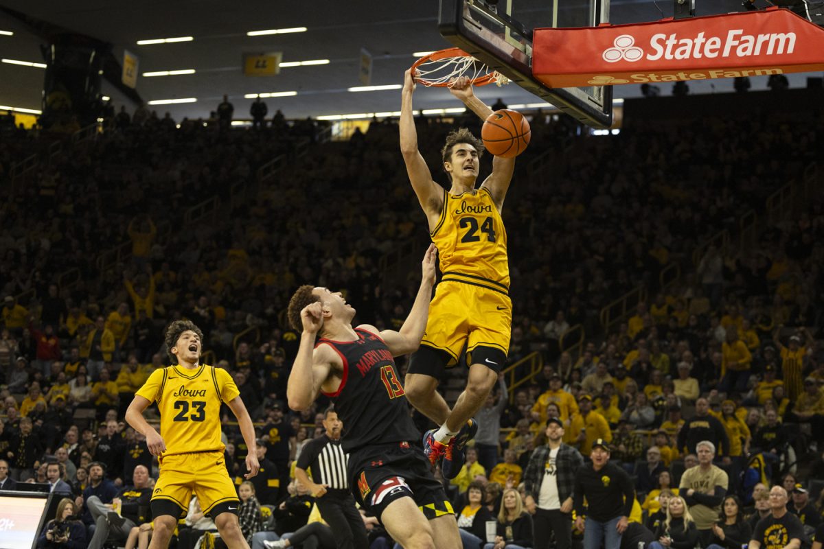 Iowa guard Tate Sage dunks the ball during a basketball game between the Iowa Hawkeyes and the Maryland Terrapins at Carver-Hawkeye Arena on Saturday, Dec. 6, 2025. The Hawkeyes defeated the Terrapins 83-64.