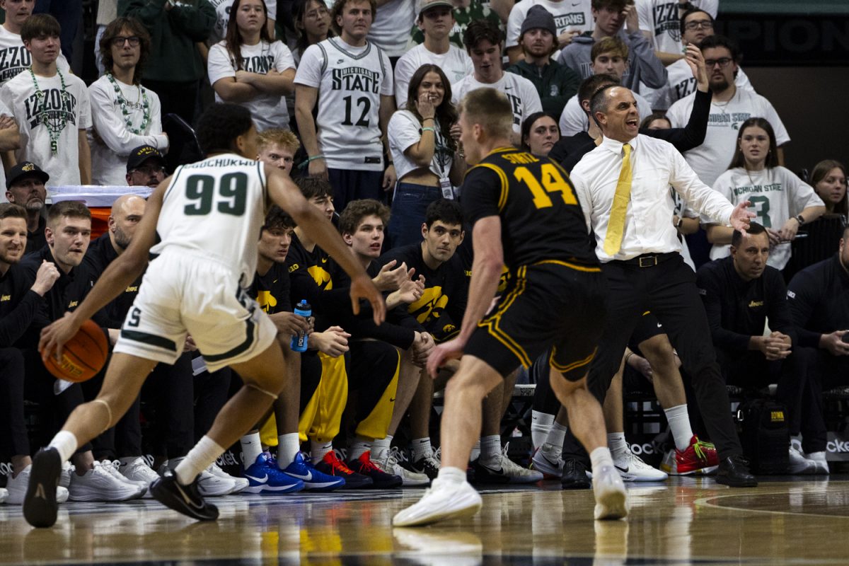 Iowa head coach Ben McCollum yells during a basketball game between the Iowa Hawkeyes and the Michigan State Spartans at the Jack Breslin Student Events Center in East Lansing, Michigan on Tuesday, Dec. 2, 2025. This is McCollum's first year with Iowa. The Spartans defeated the Hawkeyes 71-52.