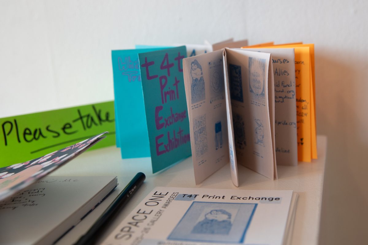 Papers are seen at Public Space One on 229 N Gilbert, Iowa City, Iowa on Dec. 2, 2025. Public Space One will be showcasing T4T Print Exchange: Trans Joy until Dec. 13.