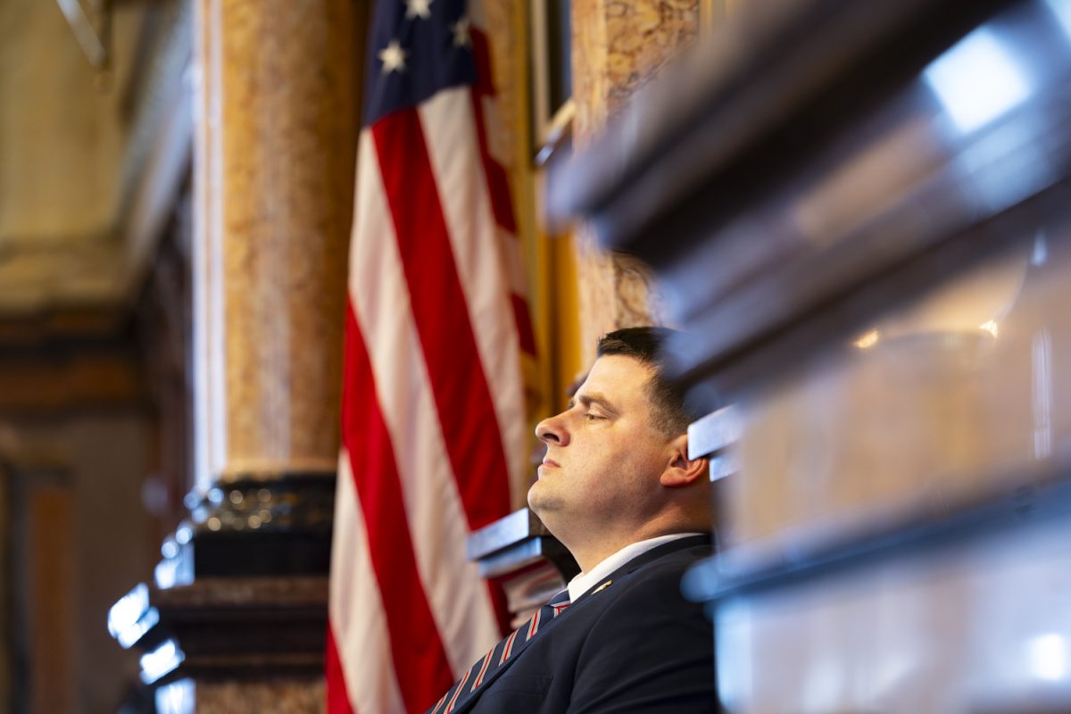 House Speaker Pat Grassley, R-Butler, leans his head against the wall as Iowa House Minority Leader Brian Meyer, D-Des Moines, speaks during the first day of the 2026 Iowa legislative session at the Iowa State Capitol in Des Moines on Monday, Jan. 12, 2026. (Samantha DeFily/The Daily Iowan)