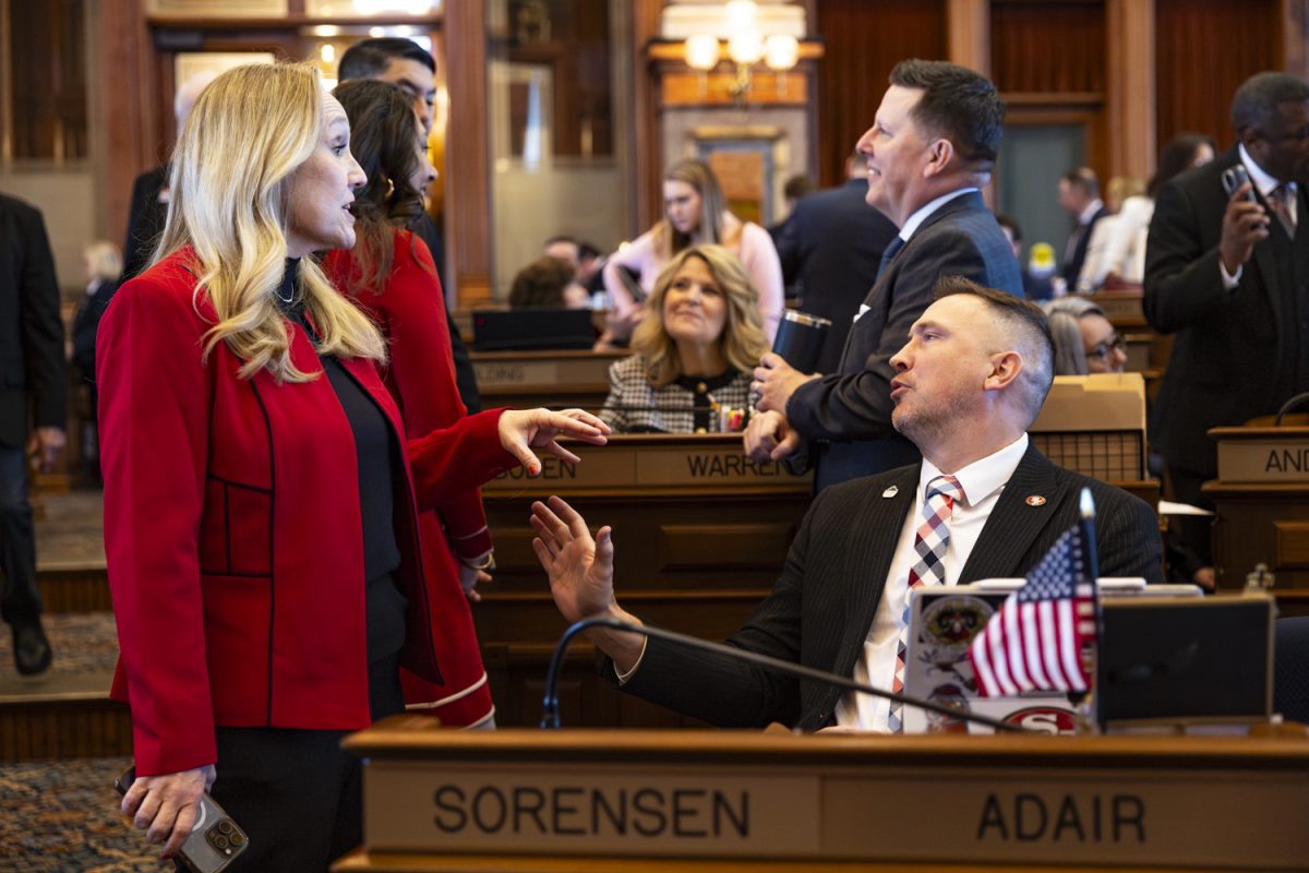 Iowa Rep. Jennifer Konfrst, D-Polk, speaks with Rep. Ray Sorensen, R-Adair, during the first day of the 2026 Iowa legislative session at the Iowa State Capitol in Des Moines on Monday, Jan. 12, 2026. (Samantha DeFily/The Daily Iowan)