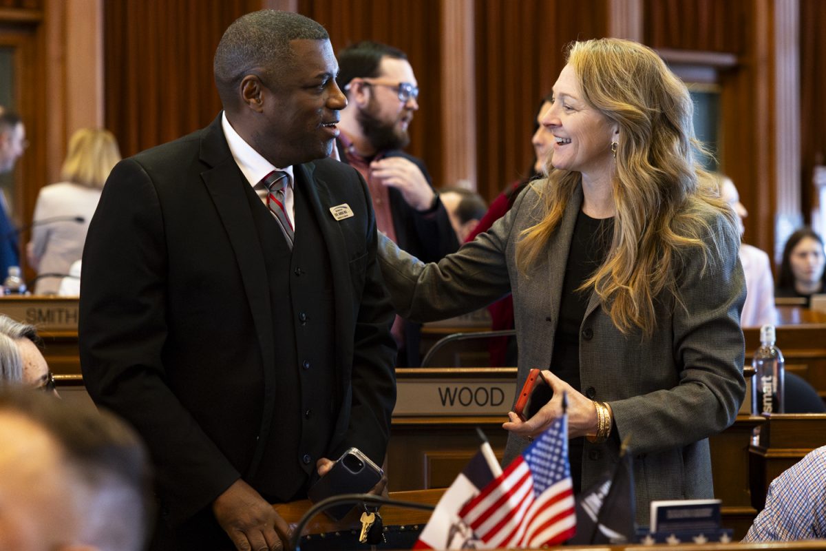 Iowa Rep. Eddie Andrews, R-Polk, speaks with Rep. Helena Hayes, R-Mahaska, a member of the Iowa House Education subcommittee, during the first day of the 2026 Iowa legislative session at the Iowa State Capitol in Des Moines on Monday, Jan. 12, 2026.