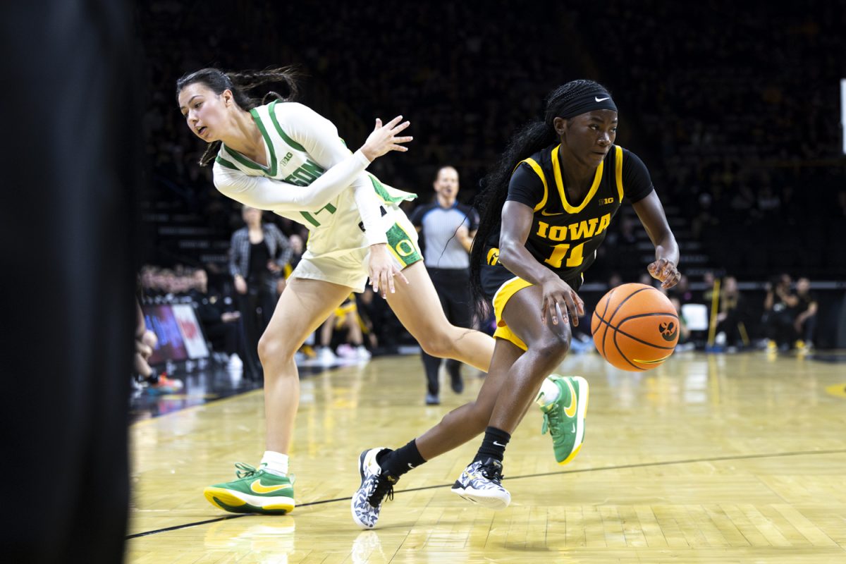 Iowa guard Chazadi Wright gets past Oregon guard Ari Long with the ball during an Iowa women’s basketball game against Oregon on Thursday, Jan. 15, 2026, at Carver-Hawkeye Arena in Iowa City, Iowa. (Samantha DeFily/The Daily Iowan)