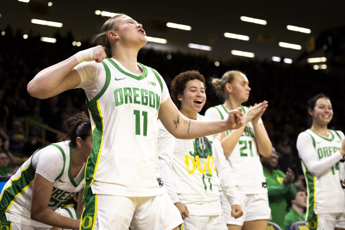 Oregon guard Sammie Wagner celebrates while on the bench during an Iowa women’s basketball game against Oregon on Thursday, Jan. 15, 2026, at Carver-Hawkeye Arena in Iowa City, Iowa. (Samantha DeFily/The Daily Iowan)