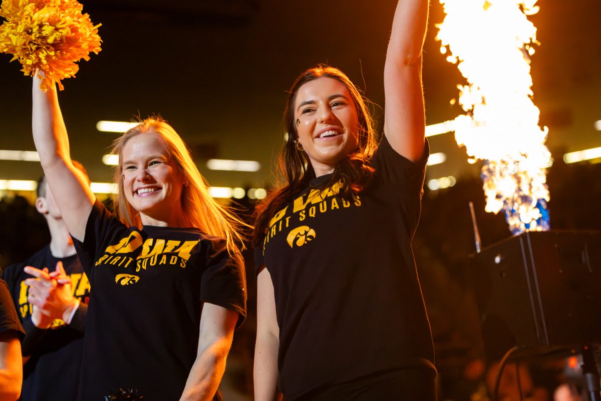 Iowa Spirit Squad members cheer in anticipation for upcoming 165 pound match during a Big10 top-five wrestling dual between the No. 4 Iowa Hawkeyes and the No. 1 Penn State Nittany Lions at Carver-Hawkeye Arena in Iowa City, Iowa on Friday, Jan. 16, 2026. (Reece Schrader/The Daily Iowan)