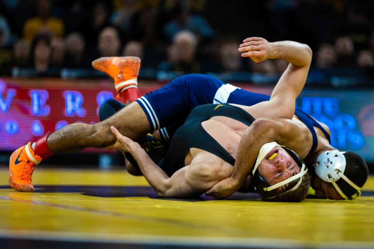 Penn State No. 1 149-pounder Shayne Van Ness attempts to pin Iowa’s No. 17 Ryder Block during a Big10 top-five wrestling dual between the No. 4 Iowa Hawkeyes and the No. 1 Penn State Nittany Lions at Carver-Hawkeye Arena in Iowa City, Iowa on Friday, Jan. 16, 2026. Van Ness defeated Block 13-5. (Reece Schrader/The Daily Iowan)