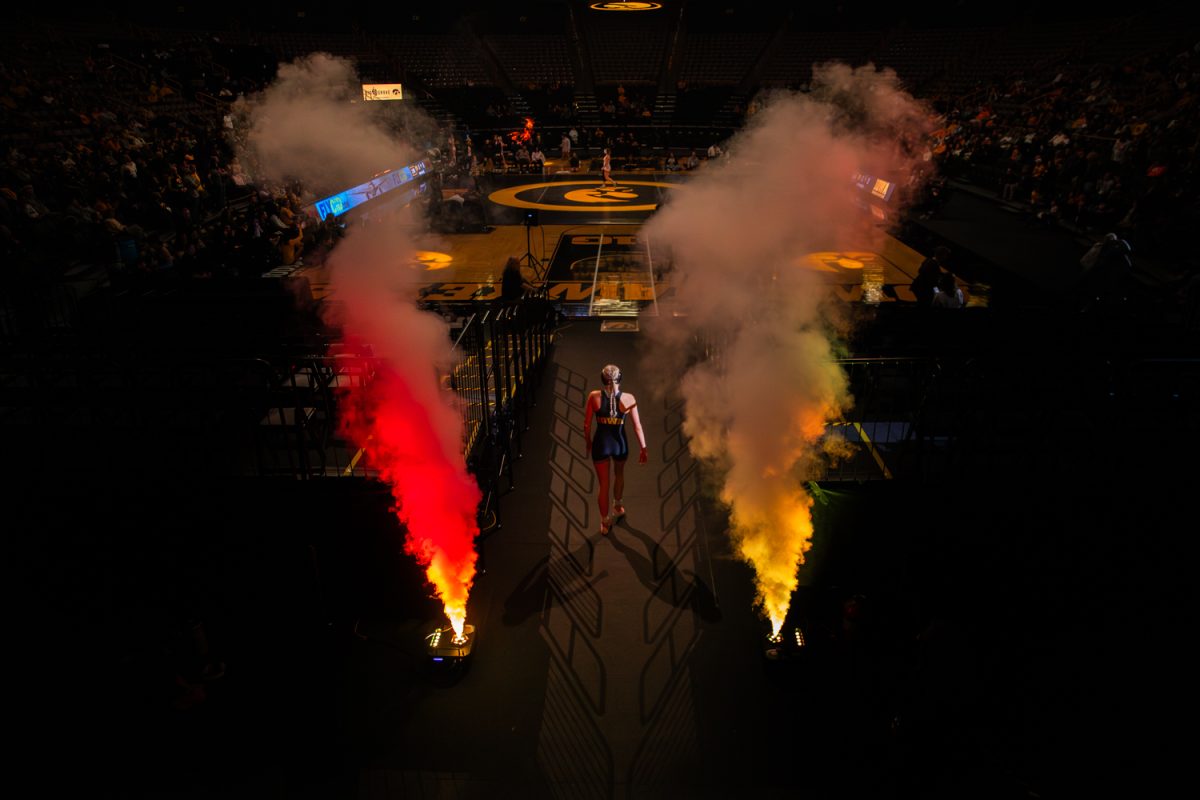 Iowa 138 pounder Ella Schmit walks out for the final time in Carver-Hawkeye Arena during a dual between the No. 1 Iowa Hawkeyes and the Otterbein Cardinals in Iowa City, Iowa on Sun, Jan. 18, 2026.  The Hawkeyes defeated the Lehigh Mountain Hawks 37-7 and the Otterbein Cardinals 42-1 on senior appreciation night.