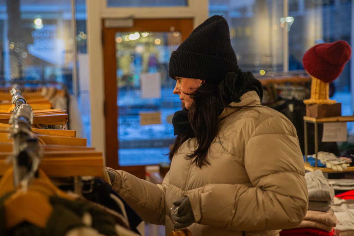 Iowa City patron Katharina Juchoff shops at Revival, a local business, on Monday, Jan. 19, 2026. In 2025, there was a reported nine million visits to the Iowa City downtown area, an increase from the last two years.