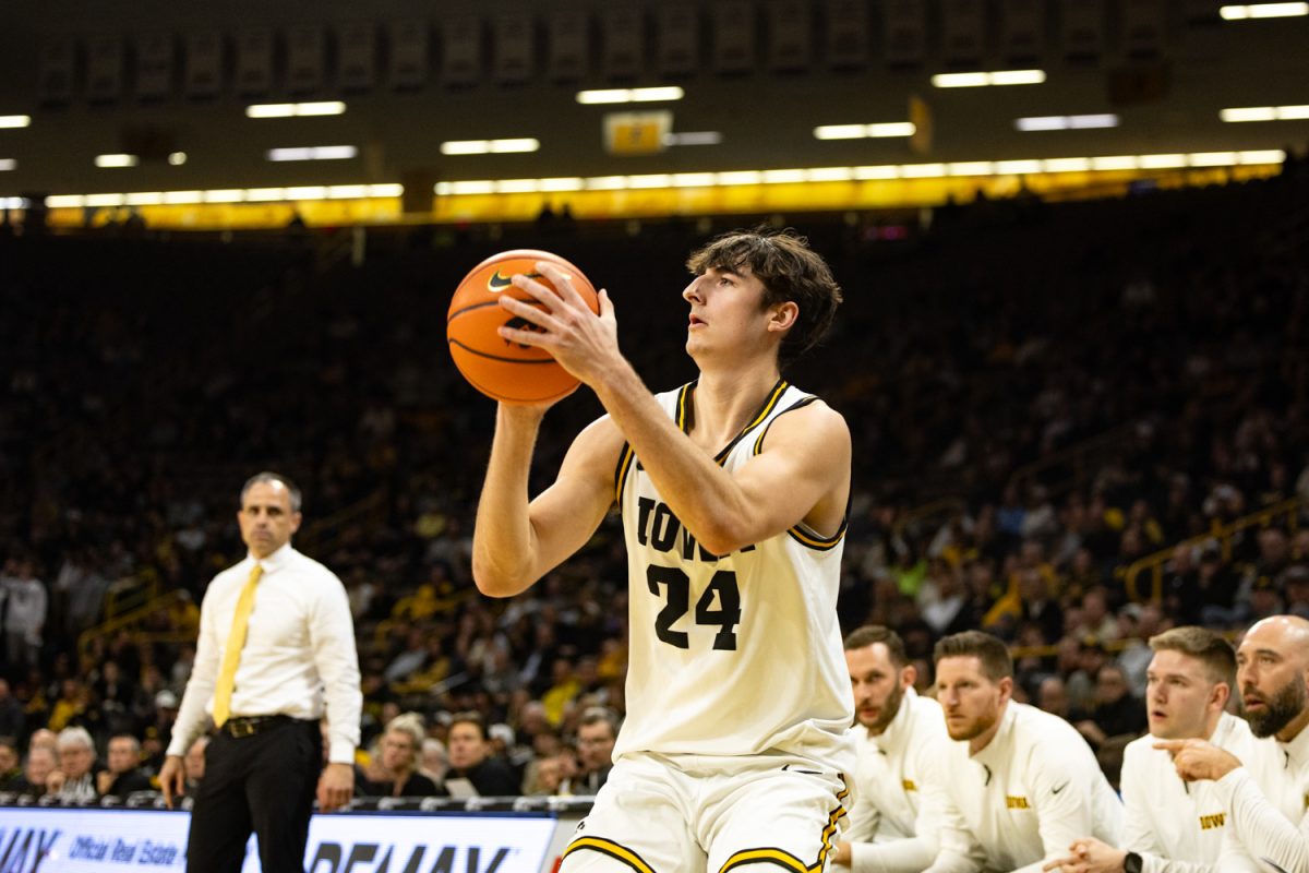 Iowa guard Tate Sage shoots from behind the arc during a basketball game between the Iowa Hawkeyes and the Rutgers Scarlet Knights at Carver-Hawkeye Arena on Tuesday, Jan. 20, 2026. Sage had 17 points. The Hawkeyes defeated the Scarlet Knights 68-62. (Samantha DeFily/The Daily Iowan)