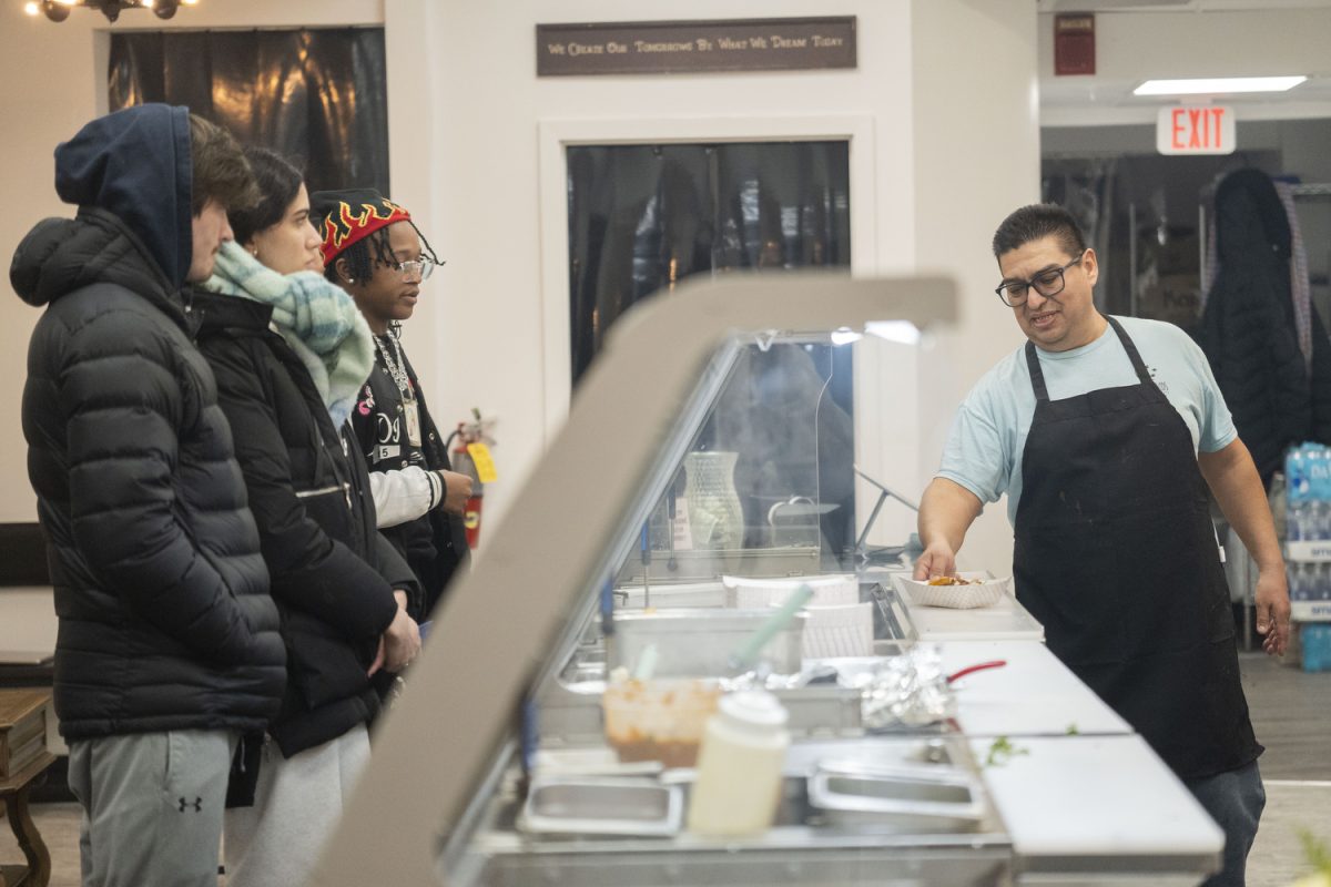 Salatiel Luna serves customers at the new downtown restaurant in Iowa City on Jan. 24. Luna’s Tacos offers a variety of Mexican food, including burritos, quesadillas, and more.