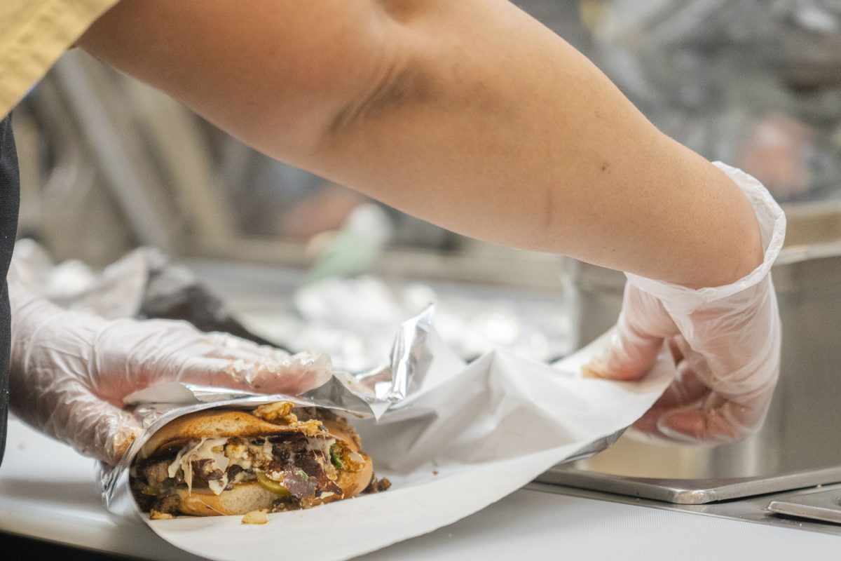 Isabel Luna wraps a burrito at the new downtown restaurant in Iowa City on Jan. 24. Luna’s Tacos offers a variety of Mexican food, including burritos, quesadillas, and more.