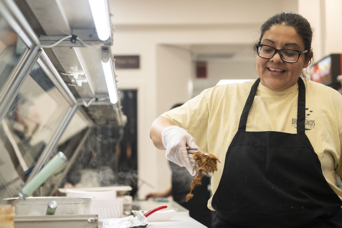 Isabel Luna grabs meat for a quesadilla Isobel Luna cooks meat at the new downtown restaurant in Iowa City on Jan. 24. Luna’s Tacos offers a variety of Mexican food, including burritos, quesadillas, and more.