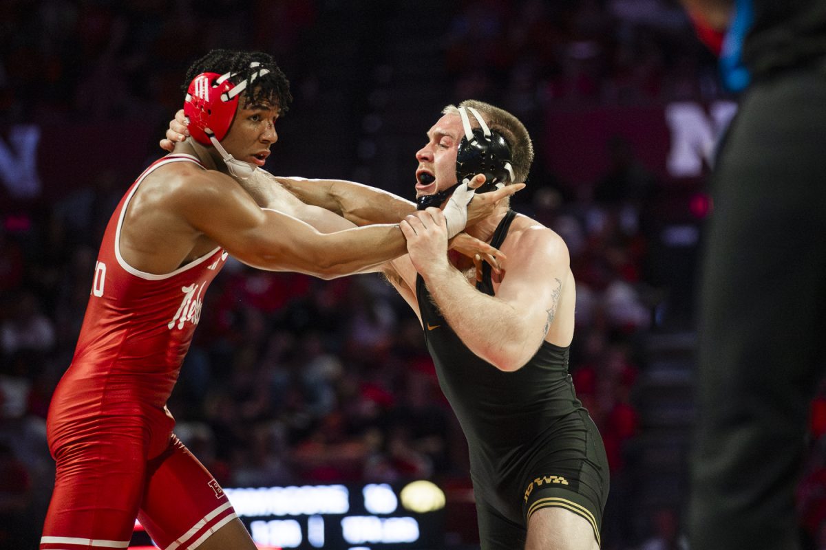 Nebraska No. 6 174-pounder Christopher Minto looks for stall call against Iowa’s No. 3 Patrick Kennedy during a dual between the No. 4 Iowa Hawkeyes and the No. 6 Nebraska Cornhuskers at Devaney Sports Center in Lincoln, Nebraska on Friday, Jan. 23, 2026. Kennedy defeated Minto by 2-1 decision. The Hawkeyes defeated the Cornhuskers 22-14. (Reece Schrader/Daily Iowan)