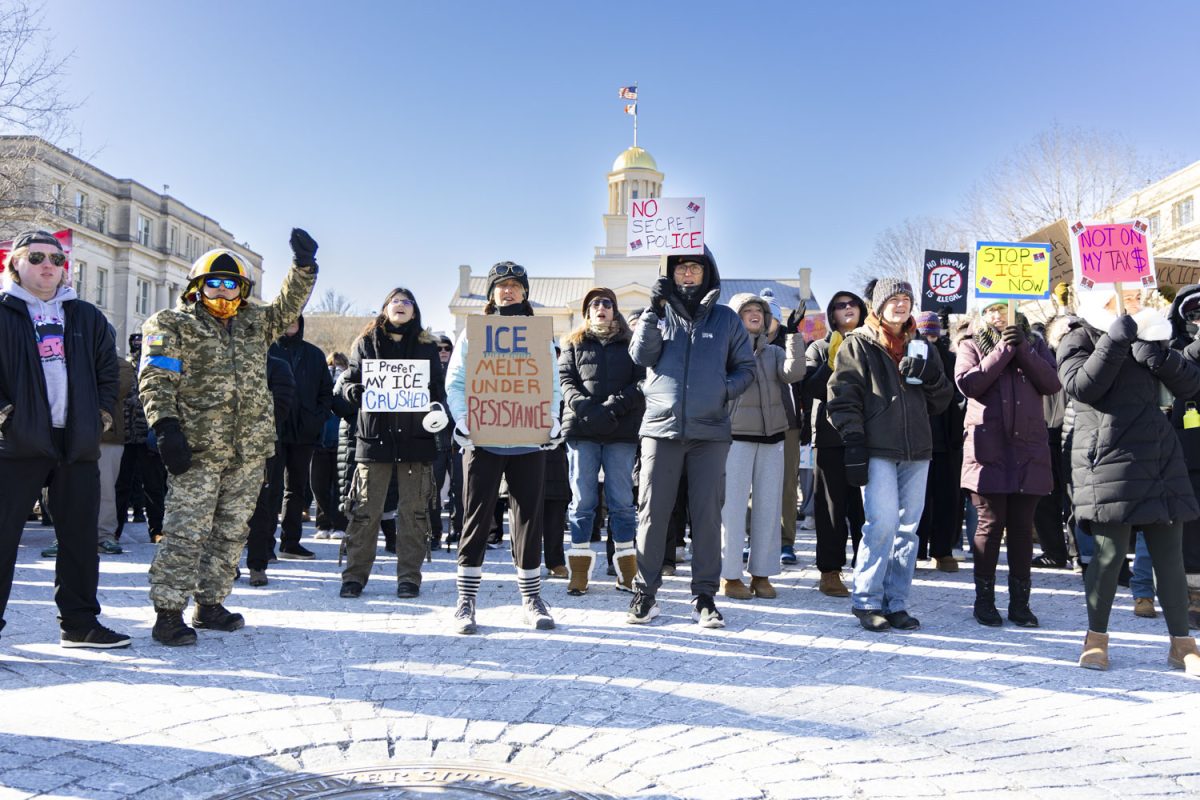 Iowa City community members chant during a protest against ICE at the University of Iowa Pentacrest on Sunday, Jan. 25, 2026, following the second fatal shooting in Minneapolis by a U.S. Immigration and Customs Enforcement (ICE) officer this month. Hundreds attended the protest that lasted a little over an hour and a half. (Samantha DeFily/The Daily Iowan)