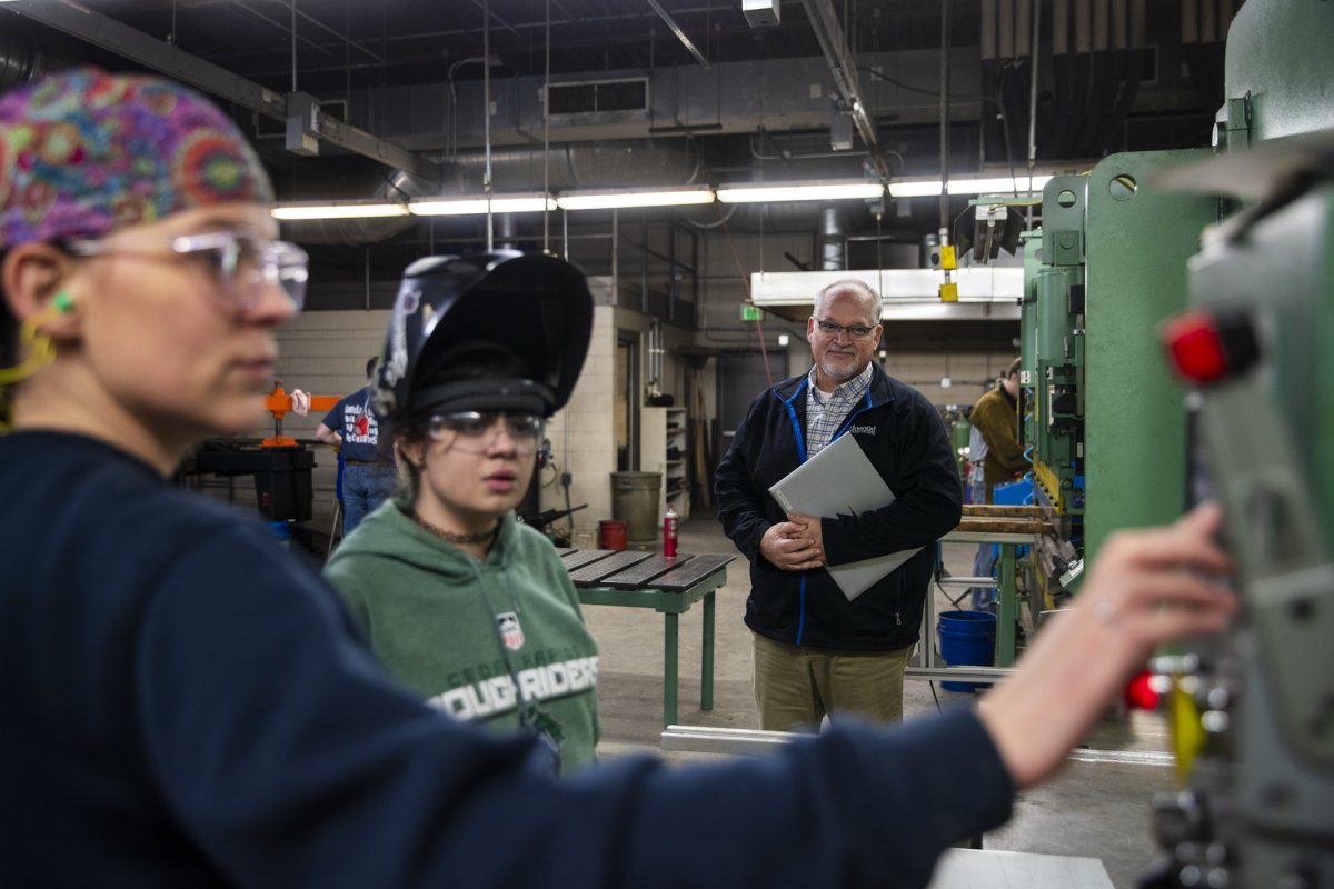 Joe Greathouse, Dean of Industrial Technologies at Kirkwood-Cedar Rapids, watches as instructor Holli Gericke walks welding student Jessica Broadwater-olds through leveling at a class in Jones Hall at Kirkwood Community College in Cedar Rapids, Iowa, on Monday, Jan. 26, 2026.