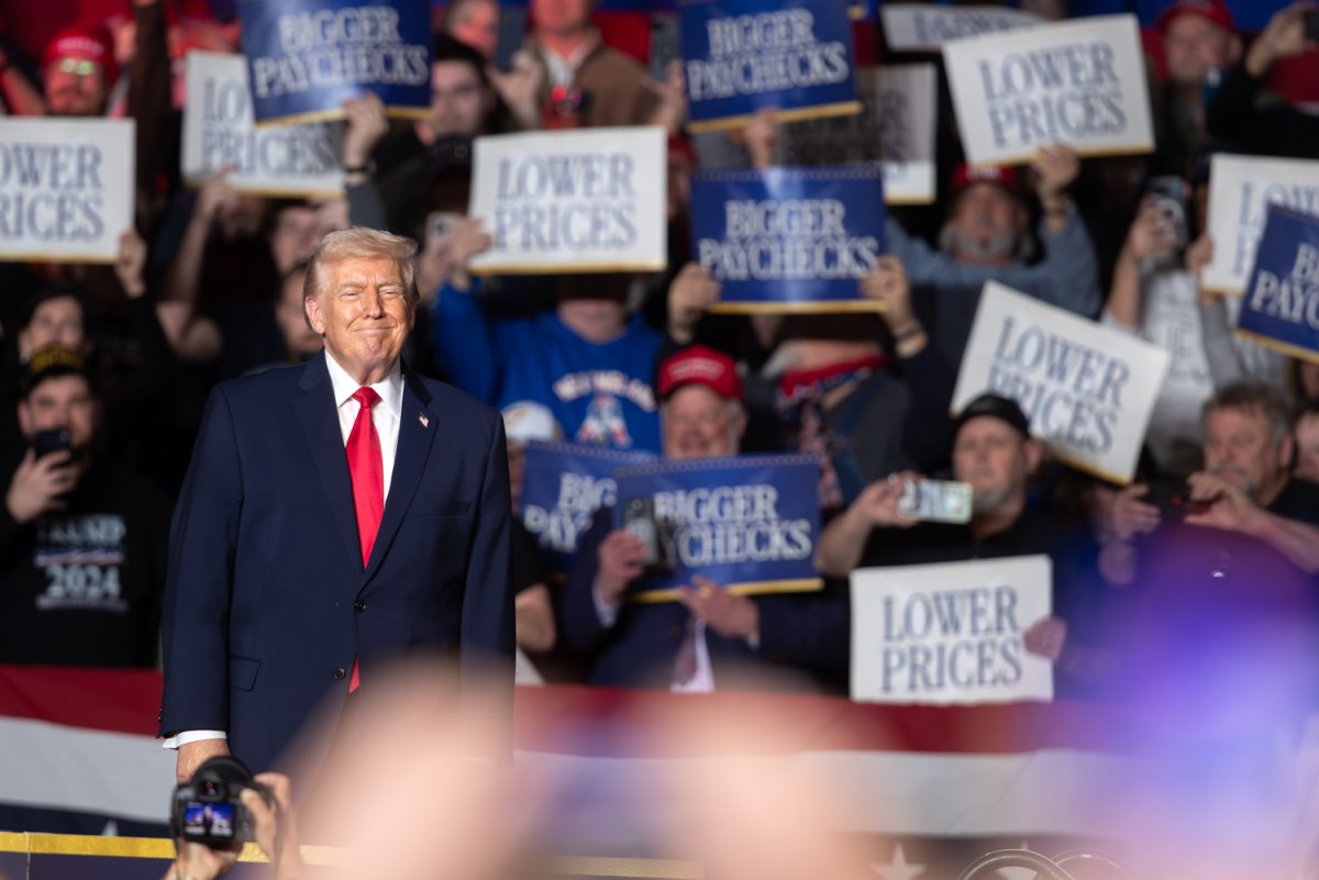 Donald Trump smiles to a crowd of supporters as he approaches the microphone during a in Clive, Iowa, on Tuesday, Jan. 27, 2026. The president made his first appearance in Iowa since summer of 2025. (Ethan McLaughlin/The Daily Iowan)