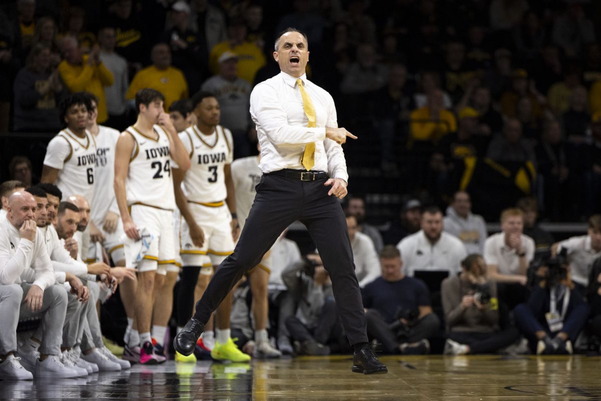 Iowa head coach Ben McCollum jumps in the air during a basketball game between the Iowa Hawkeyes and the Southern California Trojans at Carver-Hawkeye Arena on Wednesday, Jan. 28, 2026. The Hawkeyes defeated the Trojans, 73-72. (Samantha DeFily/The Daily Iowan)