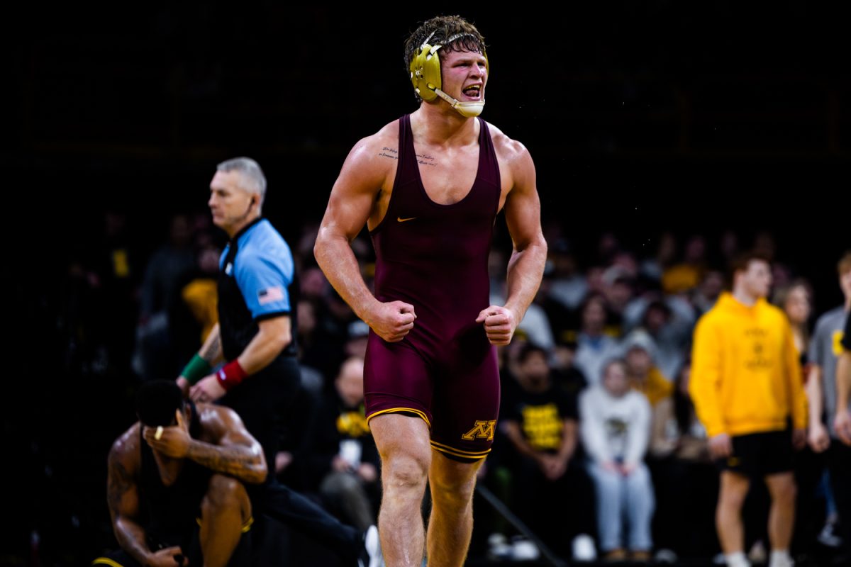 Minnesota No. 4 184-pounder Max McEnelly clenches fists after defeating Iowa’s Gabe Arnold during a dual between the No. 4 Iowa Hawkeyes and the No. 9 Minnesota Gophers at Carver-Hawkeye Arena in Iowa City, Iowa on Friday, Jan. 30, 2026. McEnnelly defeated Arnold by 4-1 decision in sudden victory. The Gophers defeated the Hawkeyes 21-16. (Reece Schrader/Daily Iowan)