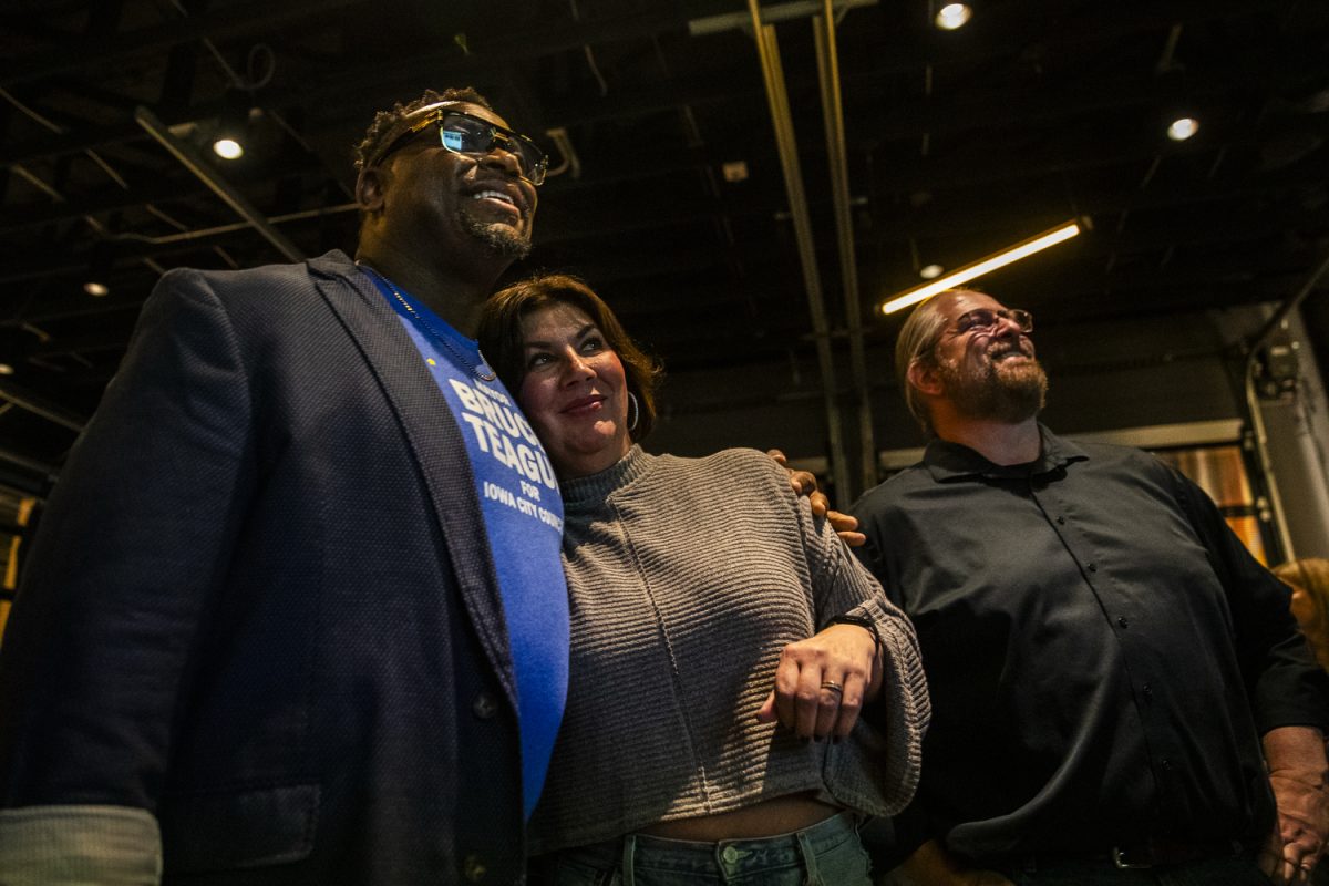Iowa City mayor Bruce Teague, city councillor Megan Alter, and city councillor Shawn Harmsen react to final poll results during a watch party at Big Grove Brewery in Iowa City on election night, Tuesday, Nov. 4, 2025. Incumbent city councillors Megan Alter, Bruce Teague, and Shawn Harmsen won at-large and District B elections, respectively, and incumbent Jayne Finch won re-election as an ICCSD School Board member.