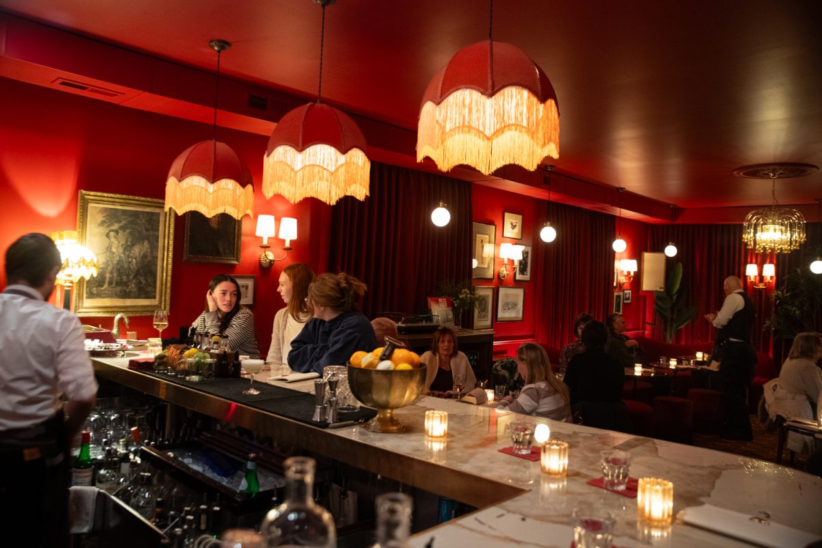 Patrons eat and drink at Claude, a new cocktail and wine bar in Iowa City on Friday, Jan. 30, 2026. The bar is owned by Adélaïde Subtil, who named the bar after her great-grandfather Claude Beauregard. The bar opened two weeks ago in the Northside District. (Ava Neumaier / The Daily Iowan)