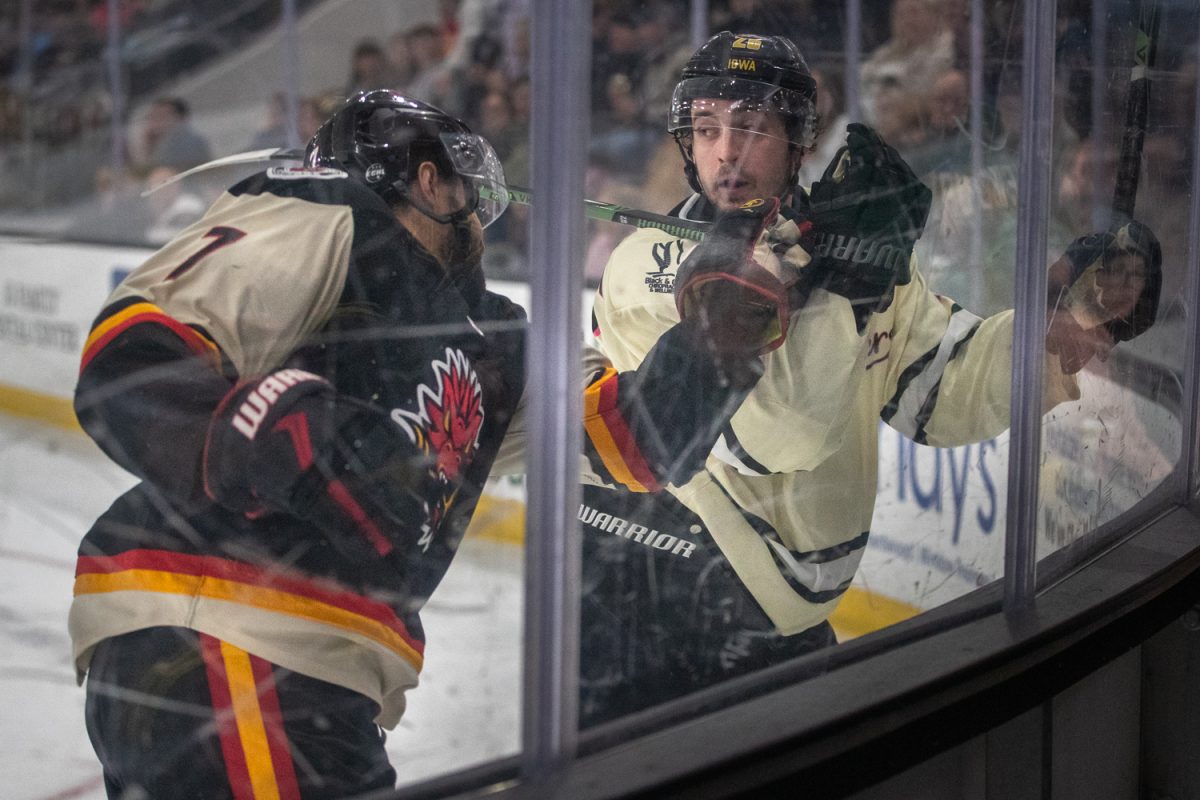 Iowa Heartlanders Defenseman Jack Robilotti clashes against Indy Fuel Forward Jadon Joseph during the teams' game on Saturday, Jan. 31, 2026, at the Xtream Arena in Coralville, Iowa. The Fuel defeated the Heartlanders in an overtime shootout, 3-2.