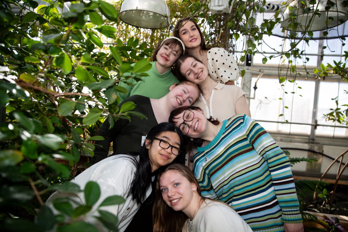 The staff of Tree Hugger Magazine poses for a staff photo in the greenhouse on Saturday, Jan. 31, 2026. Tree Hugger is a new magazine on the University of Iowa campus dedicated to environmental writing. (Ava Neumaier / The Daily Iowan)