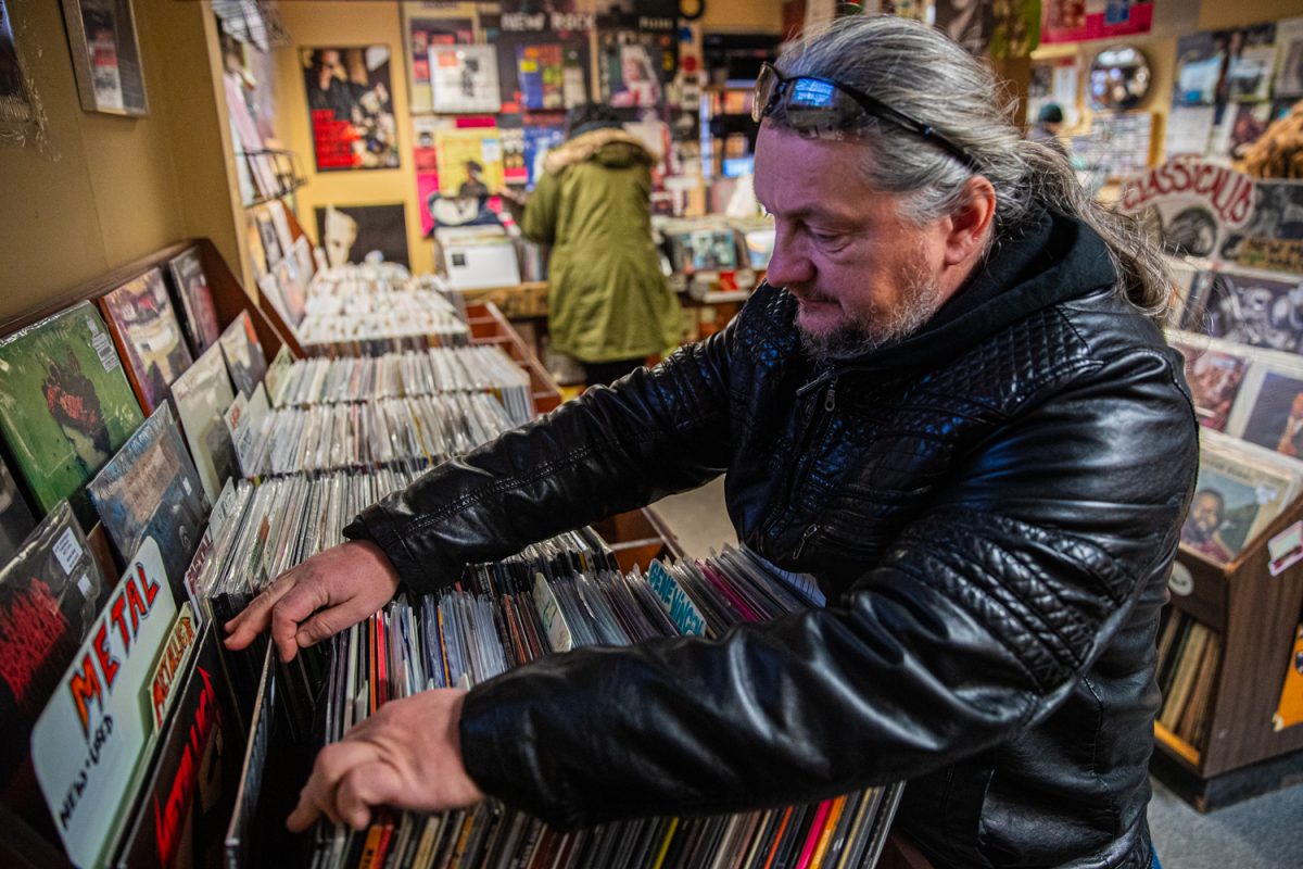 Iowa City patron Jaroslaw Pozarycki browses the vinyl selection at Record Collector, Iowa City’s only local vinyl music store in the downtown area, on Sunday, Feb. 1, 2026. The vinyl scene in the Johnson County area will be joined by a new store in North Liberty, “Zig Zog’s Records,” on Feb. 7.