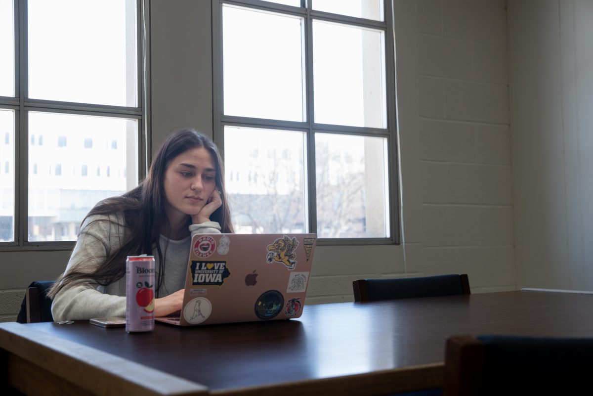 A UI student is seen studying in the Main Library in Iowa City on Monday, Feb. 2, 2026.