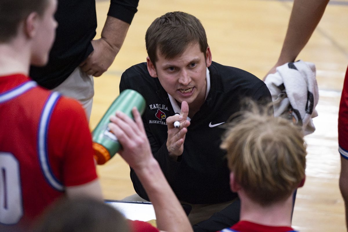 Earlham head coach Austin Ash talks with the team in a huddle during a basketball game between Earlham High School and Interstate 35 Highschool at Interstate 35 High School in Truro, Iowa on Tuesday, Feb. 3, 2026. Ash is a former Hawkeye men’s basketball player and this is his first year coaching for Earlham.