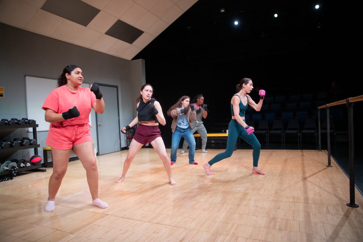 Brandi, portrayed by Dale Leonheart, shows her defense group martial arts moves in the play How to Defend Yourself at the UI Theater Building on Wednesday, Feb. 4, 2026. The play, about a DIY defense group formed after a sexual assault, opened its doors on Friday, Feb. 6, 2026. (Travis Crabb/Daily Iowan)