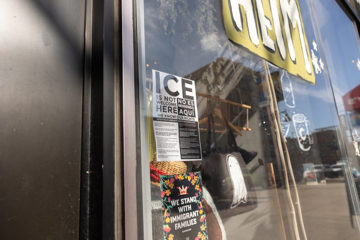 Businesses in downtown Iowa City display anti-ICE and pro-immigration signs in their business windows on Thursday, Feb. 5, 2026. (Liz Sleper/The Daily Iowan)