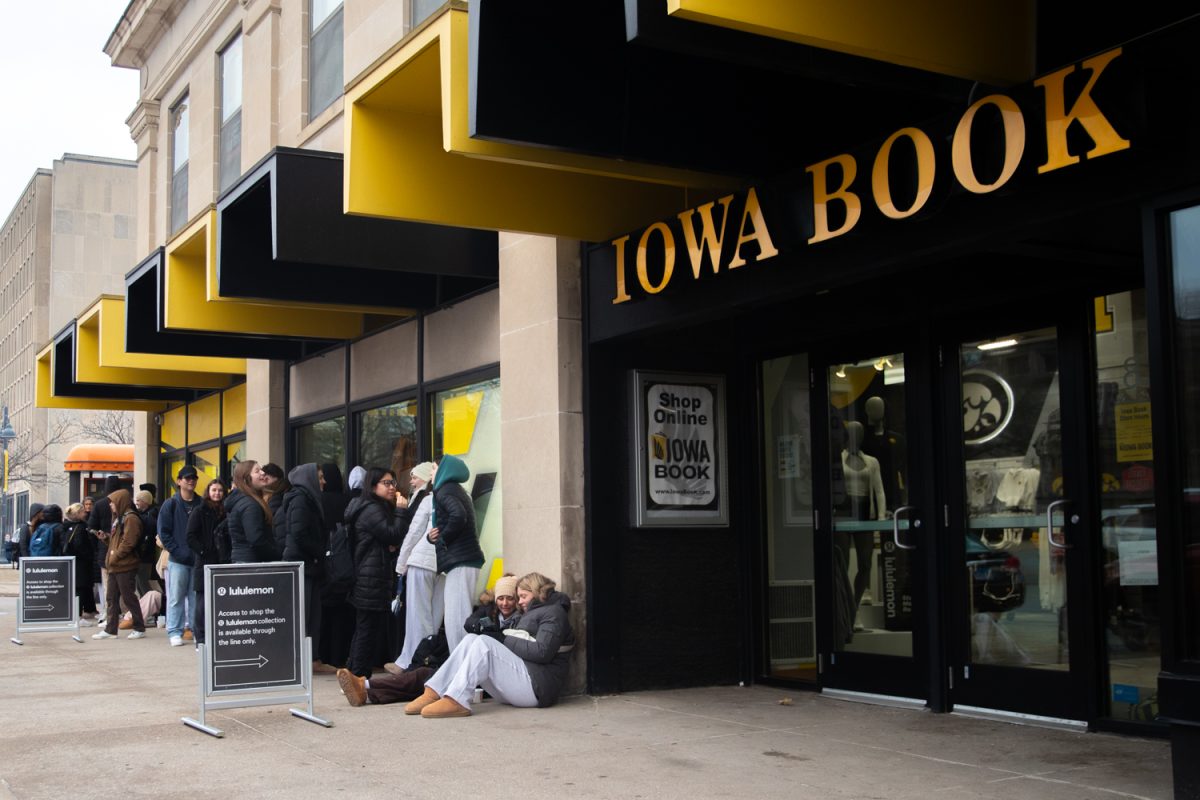 College students await the opening of Iowa Book on Clinton Street for the grand release of the Lululemon Hawkeye collection in Iowa City on Friday, Feb. 6, 2026.