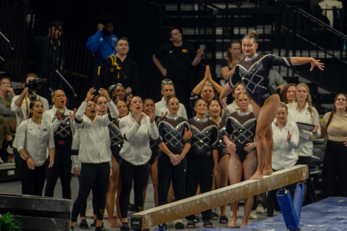 Iowa Hawkeye Gymnast Maggie Ball takes on the balance beam during the team's meet against Nebraska at the Carver Hawkeye Arena on Feb. 7, 2026.