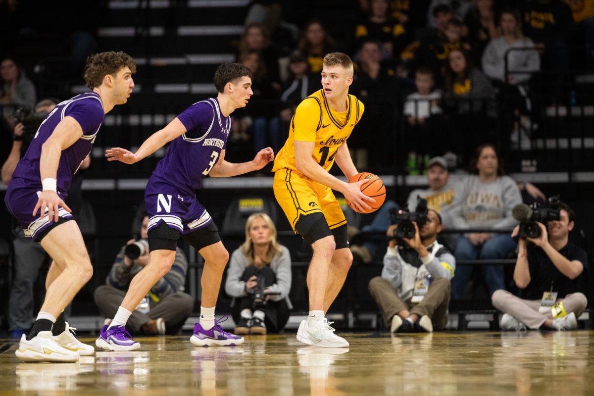 Bennet Stirtz seen backing down Jake West during a basketball game between the Iowa Hawkeyes and the Northwestern Wildcats at Carver-Hawkeye Arena on Sunday, Feb. 8, 2026. The Hawkeyes defeated the Wildcats 76-70. (Dexter Westbay/The Daily Iowan)