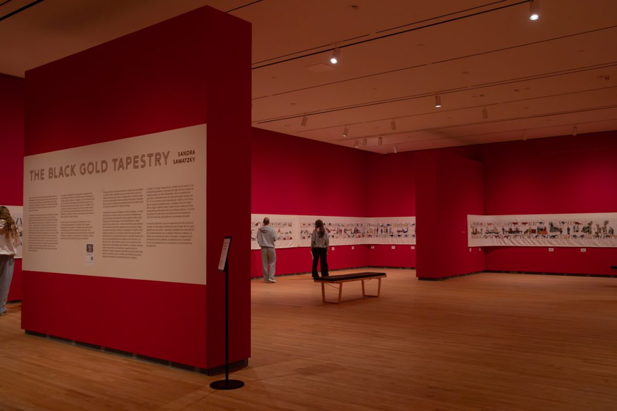 Stanley Museum of Art patrons attend the Sandra Sawatzky’s The Black Gold Tapestry exhibition on Thursday, Feb. 12, 2026. The tapestry follows one singular story, along 220 feet of hand-embroidered linen.