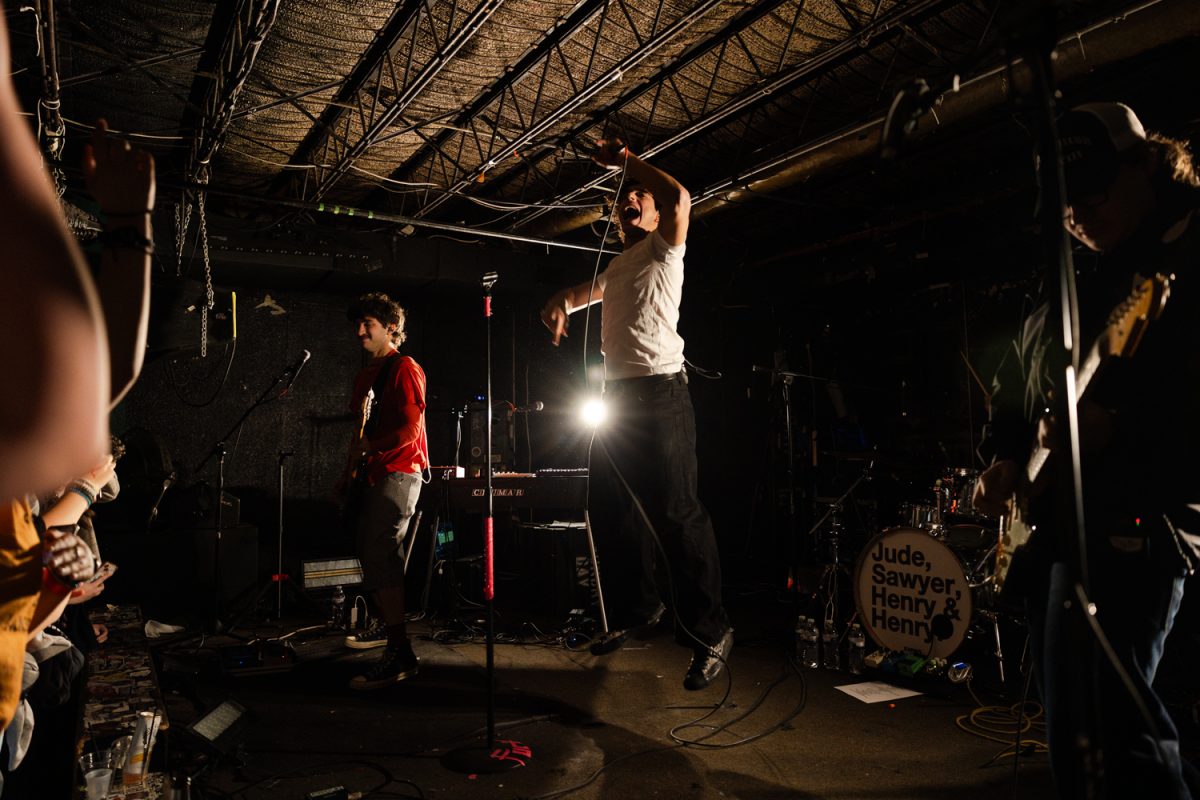 From left to right, Henry Pearl, Jude Ciulla, and Henry Elias, members of the indie-pop band Laundry Day, play their opening number “R U READY?” at the band’s concert at Gabe’s in Iowa City on Feb. 13, 2026. The concert was one stop of the band’s “Time of Your Life” North American tour. (Liz Sleper / The Daily Iowan)