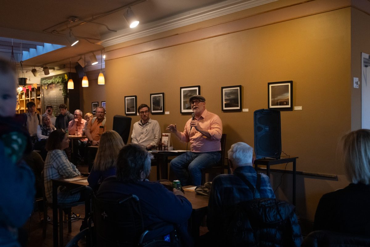 Dr. Bob Cargill talks about the impact of the Dead Sea Scrolls on the interpretation of the Bible during the first official event of the partnership between the University of Iowa and the Downtown District at Prairie Lights Cafe in Iowa City, IA, on Wednesday, Feb. 18, 2026. Dr. Bob Cargill has been teaching archaeology at the University of Iowa since 2011. (Sal Yang/The Daily Iowan)