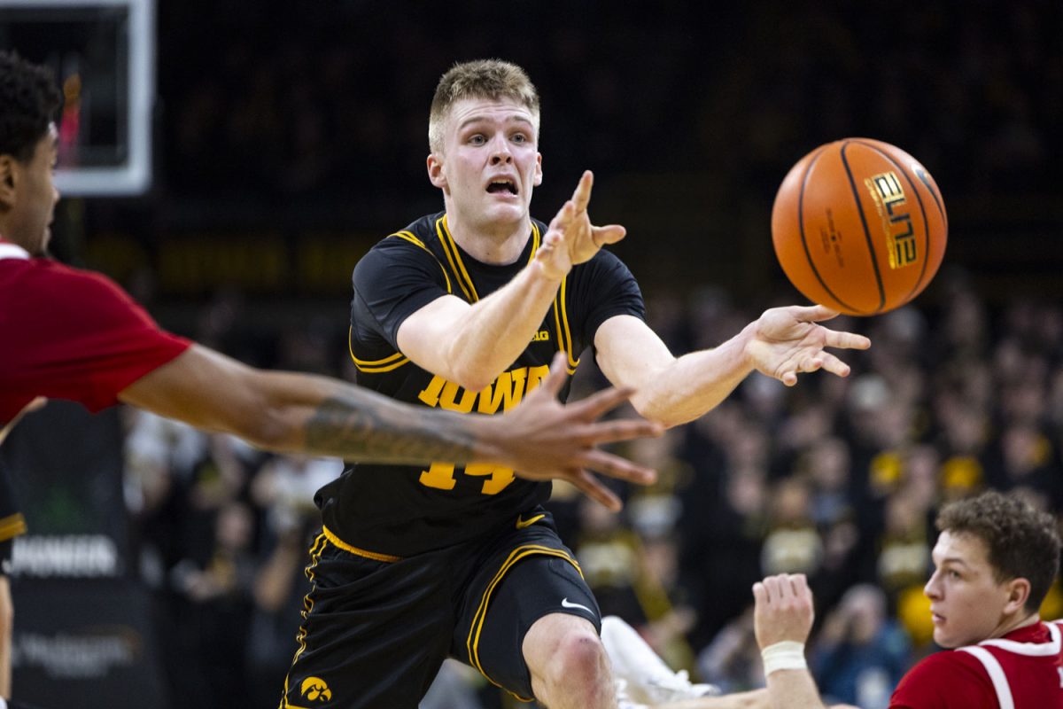 Iowa guard Bennett Stirtz passes the ball during a basketball game between the Iowa Hawkeyes and the No. 9 Nebraska Cornhuskers at Carver-Hawkeye Arena on Tuesday, Feb. 17, 2026. The Hawkeyes upset the Cornhuskers, 57-52. (Samantha DeFily/The Daily Iowan)