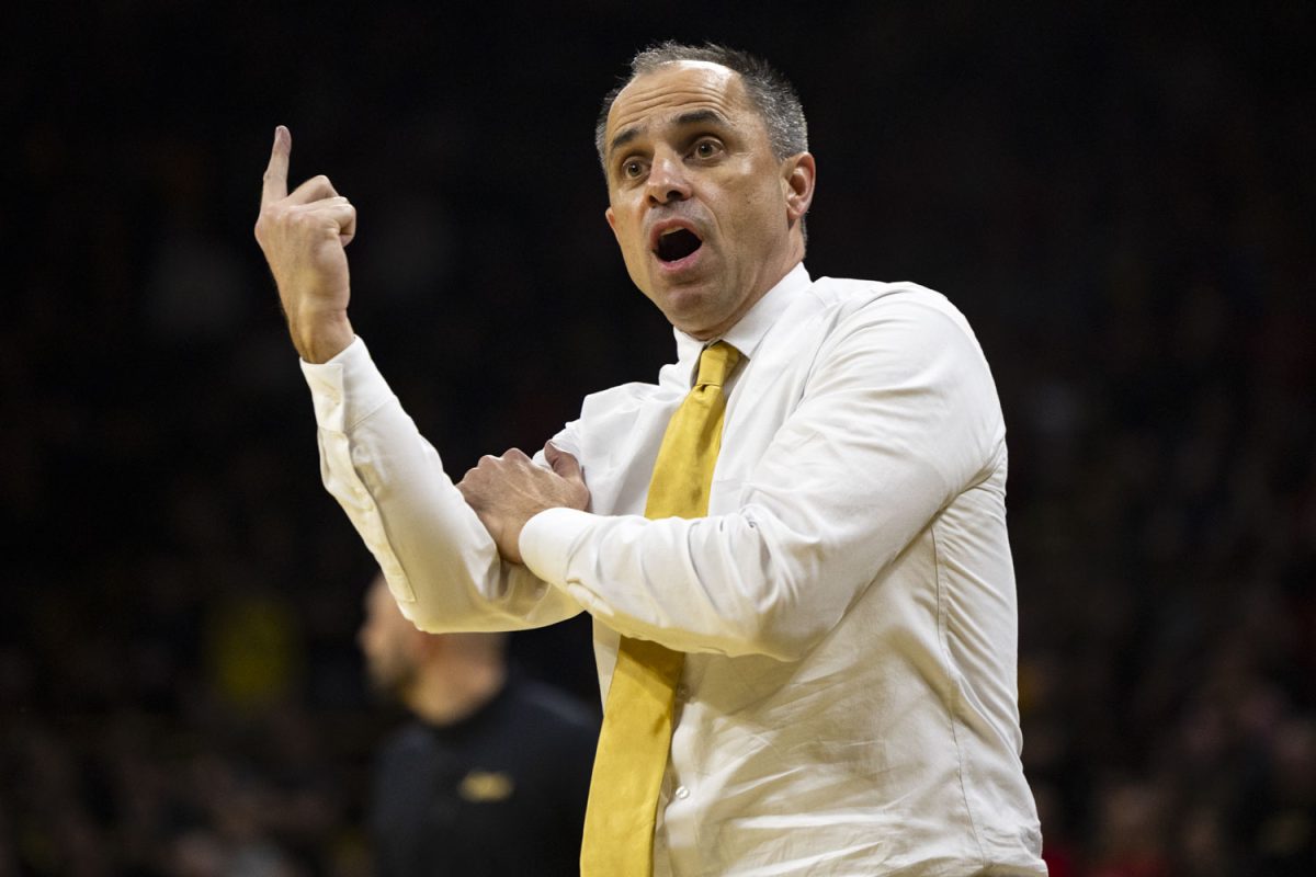 Iowa head coach Ben McCollum yells at a referee and points at the screen during a basketball game between the Iowa Hawkeyes and the No. 9 Nebraska Cornhuskers at Carver-Hawkeye Arena on Tuesday, Feb. 17, 2026. The Hawkeyes upset the Cornhuskers, 57-52. (Samantha DeFily/The Daily Iowan)
