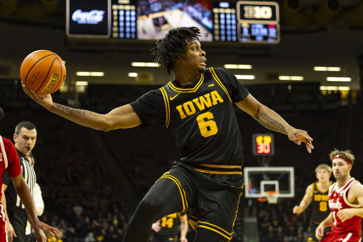 Iowa guard Tavion Banks attempts to stop the ball from going out of bounds during a basketball game between the Iowa Hawkeyes and the No. 9 Nebraska Cornhuskers at Carver-Hawkeye Arena on Tuesday, Feb. 17, 2026. The Hawkeyes upset the Cornhuskers, 57-52. (Samantha DeFily/The Daily Iowan)