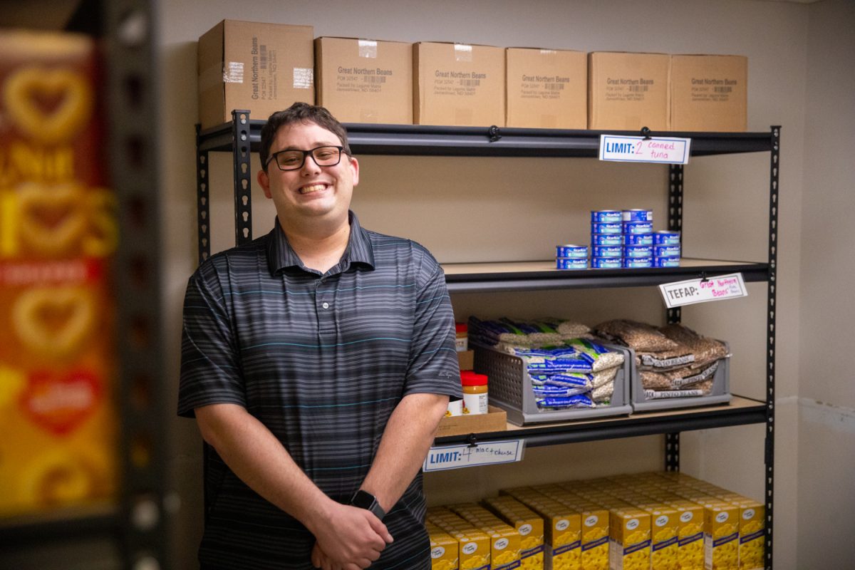 Director of Client Support Services Douglas Krough poses for a portrait inside the Successful Living new food pantry in Iowa City on Friday, Feb. 20, 2026. Krough has worked with Successful Living for four years and has been under this title for a year.