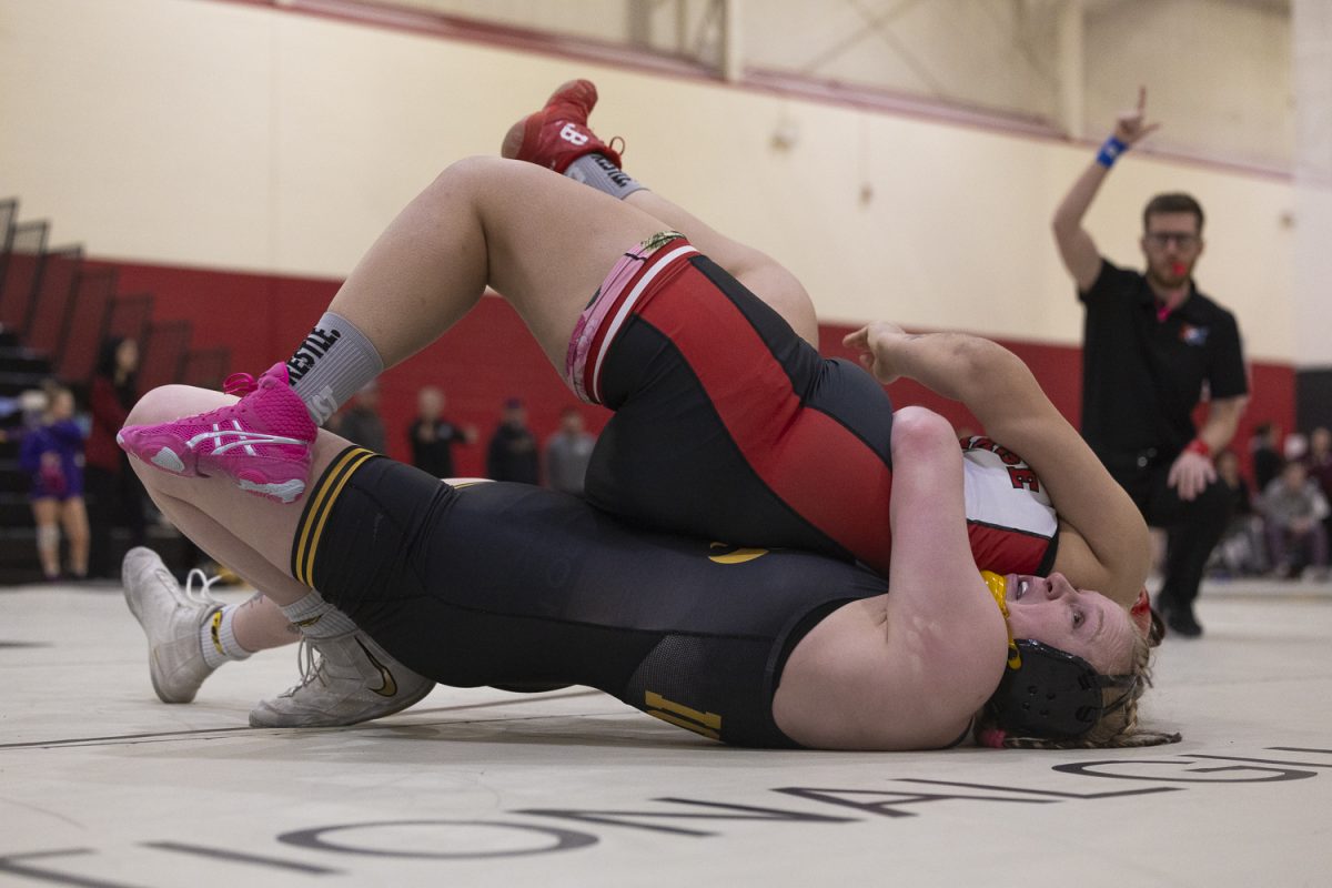 Iowa 207 pounder Katja Osteen performs a gator roll on Carthage College 207 pounder Jasmin Ocampo in her semifinal match on the second day of NCAA Regionals in the Cowles Field House at Simpson College in Indianola on Saturday, Feb. 21, 2026. Osteen won this match 5-0 by pin to go to the 1st place match. Every Iowa wrestler made it to the 1st place match, sweeping the semifinal round.