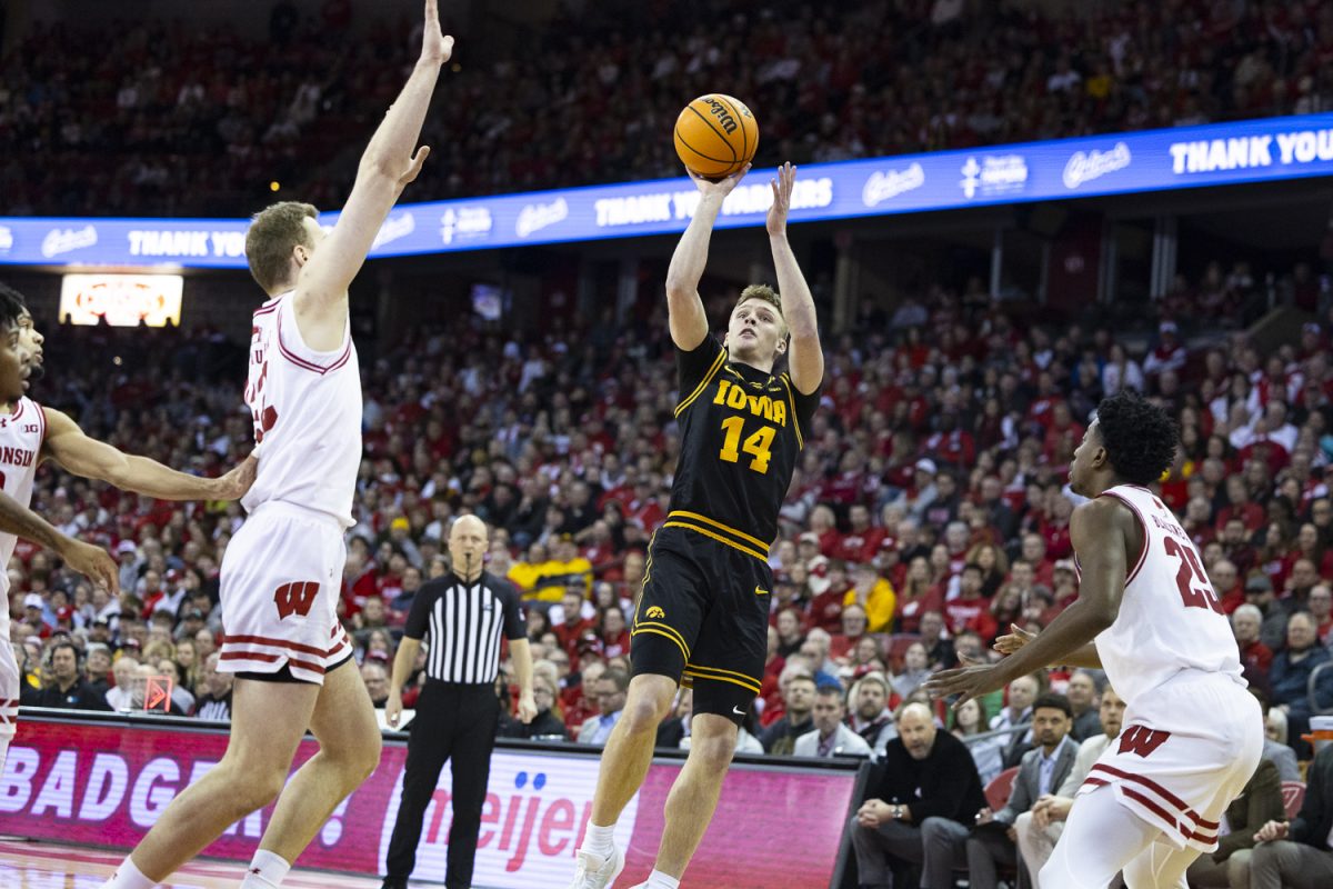 Iowa guard Bennett Stirtz shoots the ball during a basketball game between the Iowa Hawkeyes and the No. 24 Wisconsin Badgers at the Kohl Center in Madison, Wisconsin on Sunday, Feb. 22, 2026. The Hawkeyes fell to the Badgers, 84-71. (Samantha DeFily/The Daily Iowan)