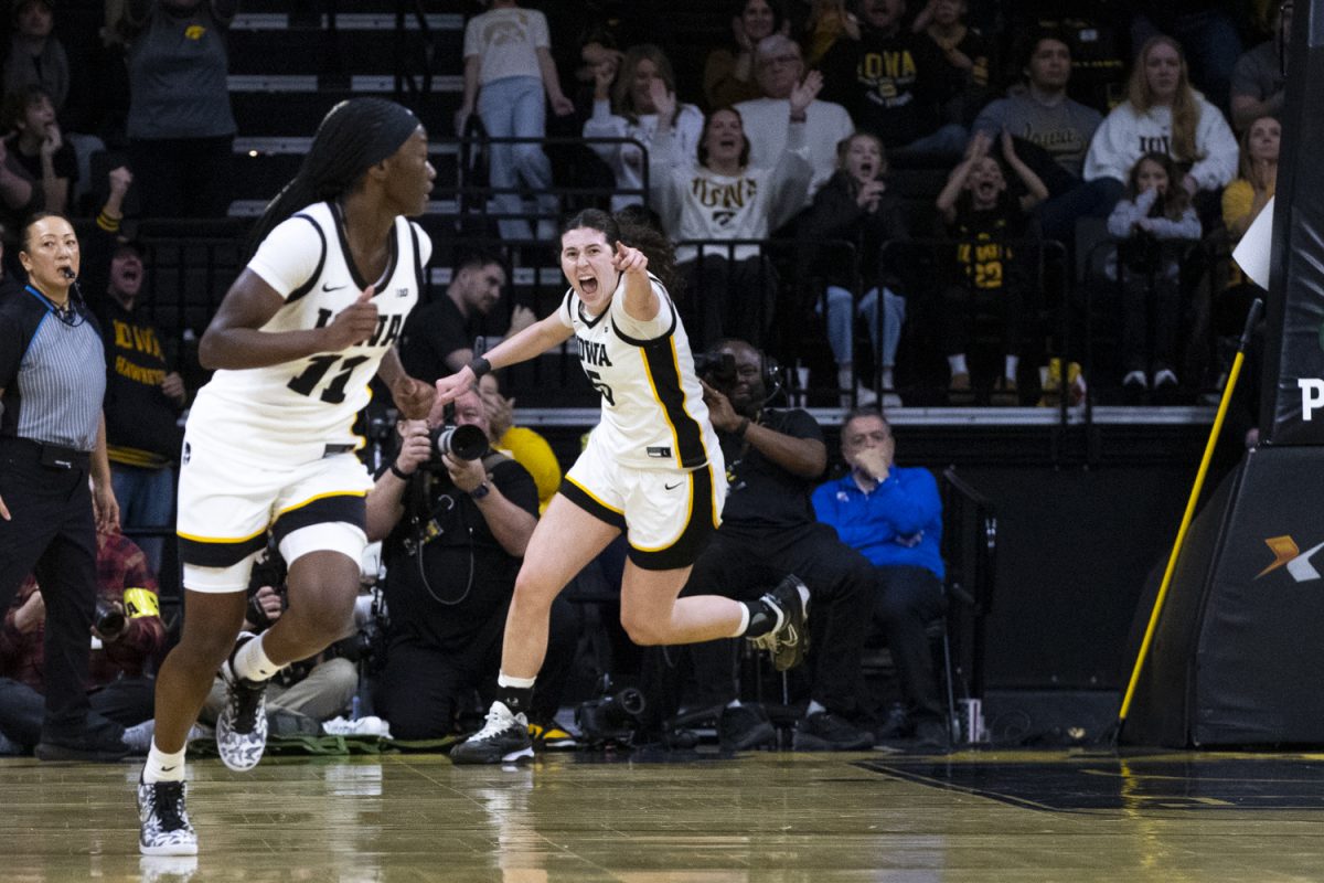Iowa sophomore center Ava Heiden celebrates a bucket in the paint at the basketball game between No. 13 Iowa and No. 6 Michigan at Carver-Hawkeye Arena in Iowa City on Sunday, Feb. 22, 2026. Heiden led the Hawkeyes to a big win with her 24 points, 11 more points than anyone else at the game today. Iowa beat Michigan 62-44, the first time this season that Michigan has scored under 50 points. (Travis Crabb/Daily Iowan)