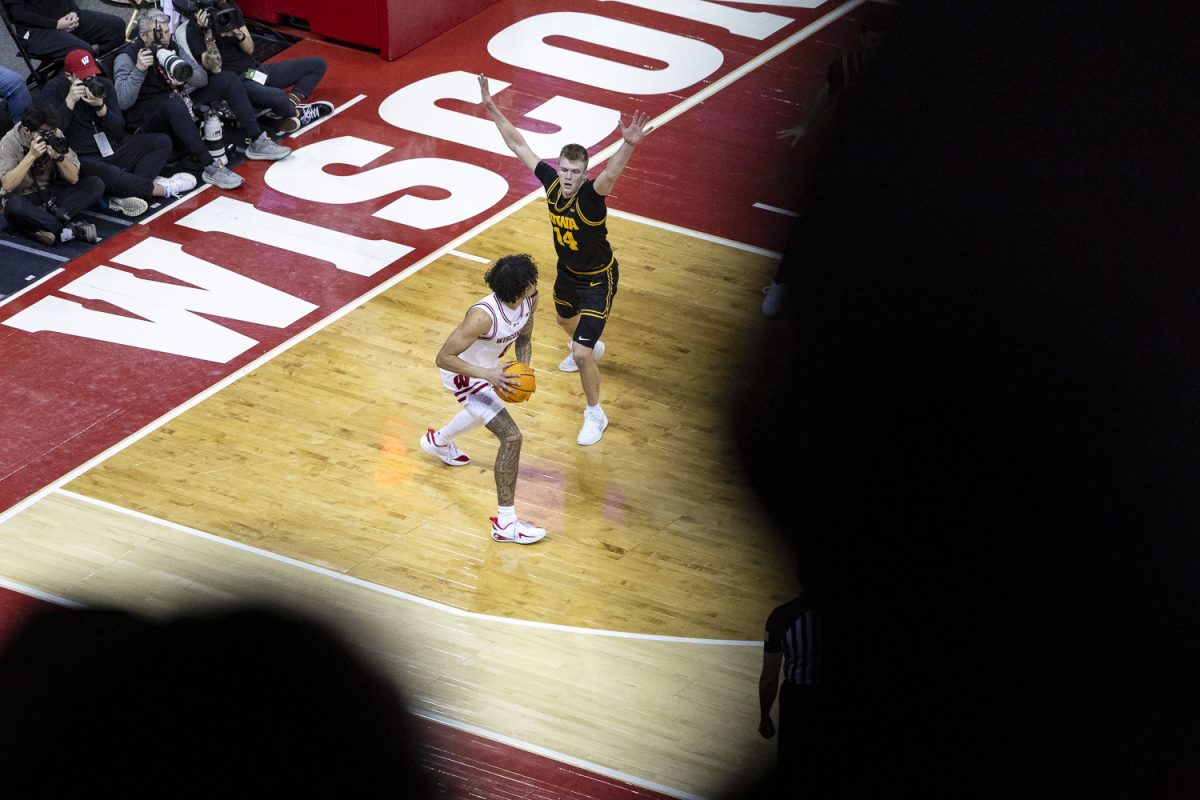 Iowa guard Bennett Stirtz attempts to block Wisconsin guard Braeden Carrington during a basketball game between the Iowa Hawkeyes and the No. 24 Wisconsin Badgers at the Kohl Center in Madison, Wisconsin on Sunday, Feb. 22, 2026. The Hawkeyes fell to the Badgers, 84-71.