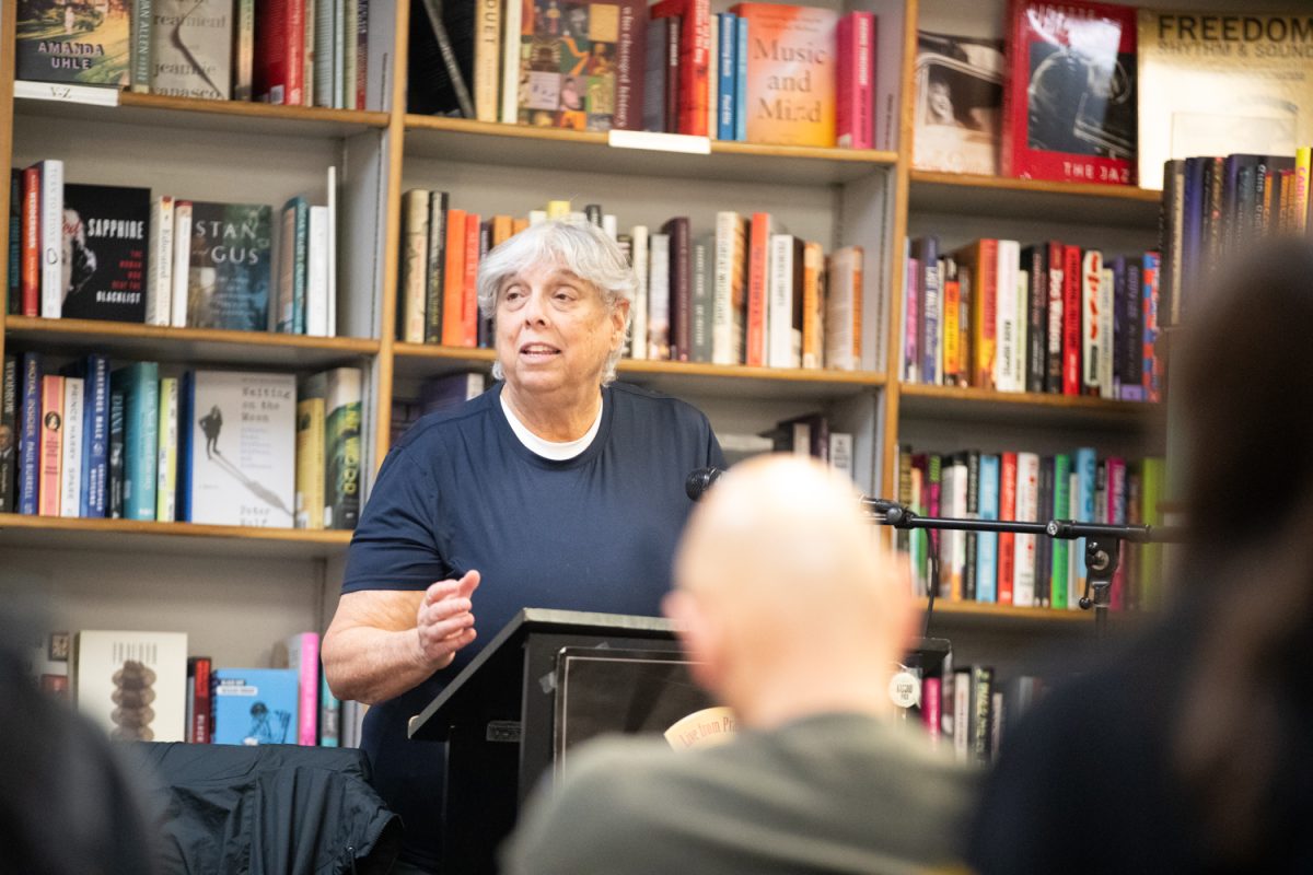 Author Clare Kinberg reads her book “The Waters of Paradise: An American Story of Racism and Rupture in a Jewish Family,” to a live audience inside Prairie Lights book store in Iowa City on Monday, Feb. 23, 2026. The novel was published in October 2025. (Patrick Murphy/The Daily Iowan).