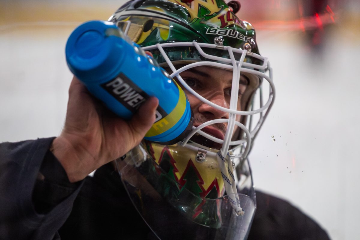 Heartlander Goalie Riley Mercer refuels during a hockey game between the Iowa Heartlanders and the Kalamazoo Wings at Xtream Arena in Coralville, Iowa on Wednesday, Feb. 11, 2026. The Wings defeated the Heartlanders 7-3.