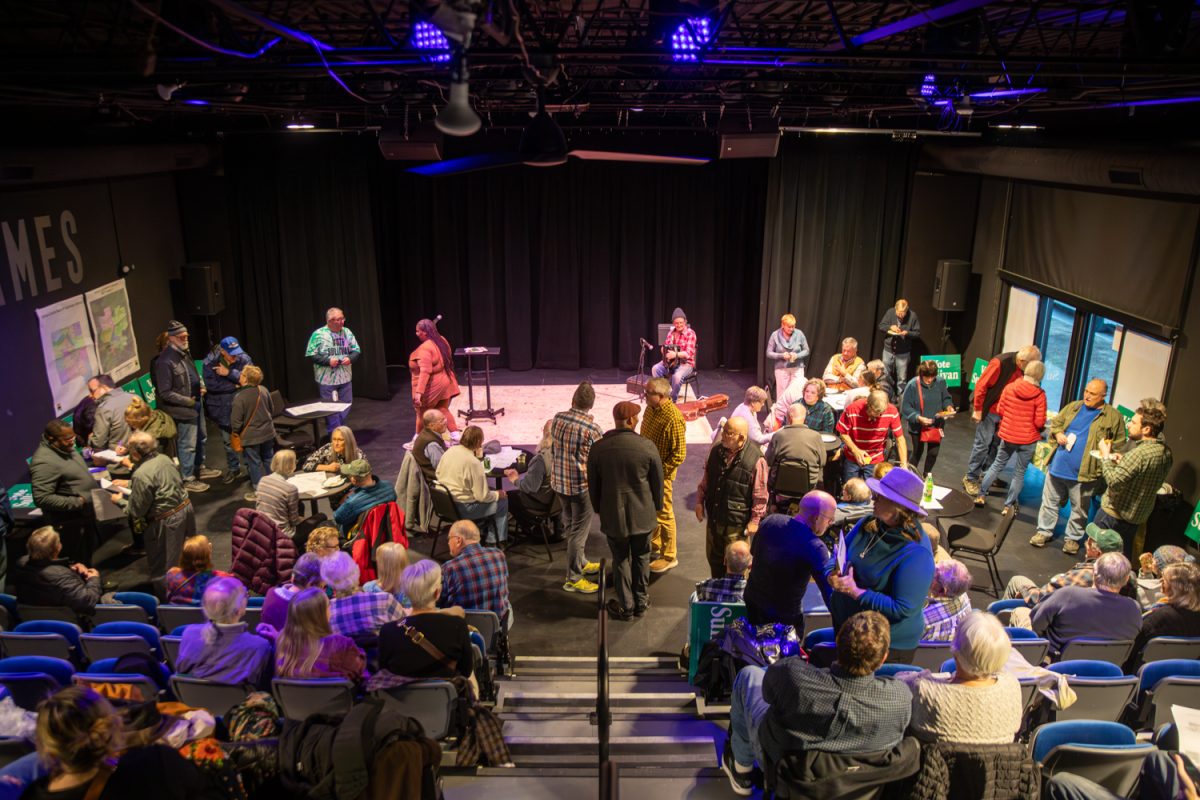 People in the crowd converse with each other at Rod Sullivan’s campaign launch at the James Theater in Iowa City, Iowa on Wednesday, Feb. 25, 2026. (Andy Espineira/The Daily Iowan)