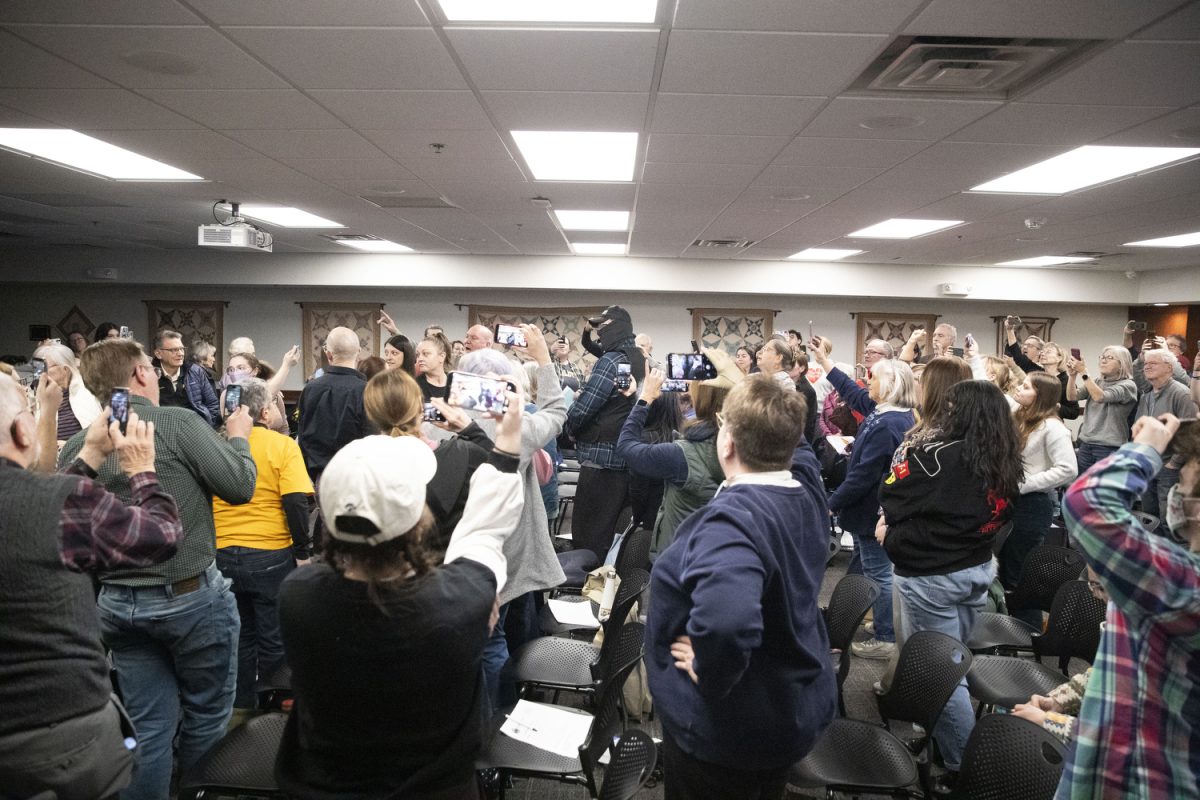 Attendees participate in a practice simulation of an ICE encounter during a Know Your Rights Training at the Coralville Public Library in Coralville on Friday, February 27, 2026. The training was targeted towards nonprofits and volunteers who may have encounters with ICE.  (Isabella Tisdale/The Daily Iowan)